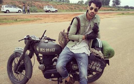 Dhairya Karwa posing with his bike