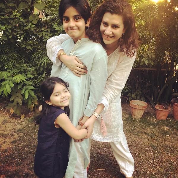 Omair Rana's wife with his children