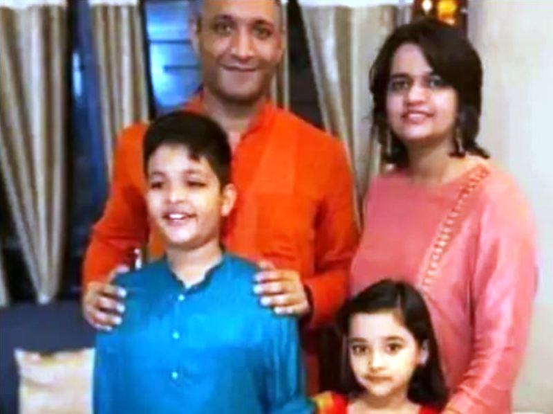 Varun Singh with his wife and children