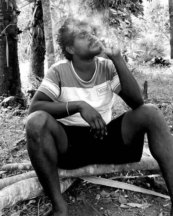 A picture of Jagadeesh Prathap Bandari smoking a cigarette