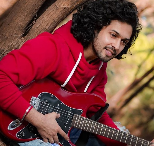 Devesh Sharma playing the guitar