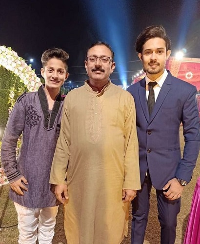 Devesh Sharma with his father and brother