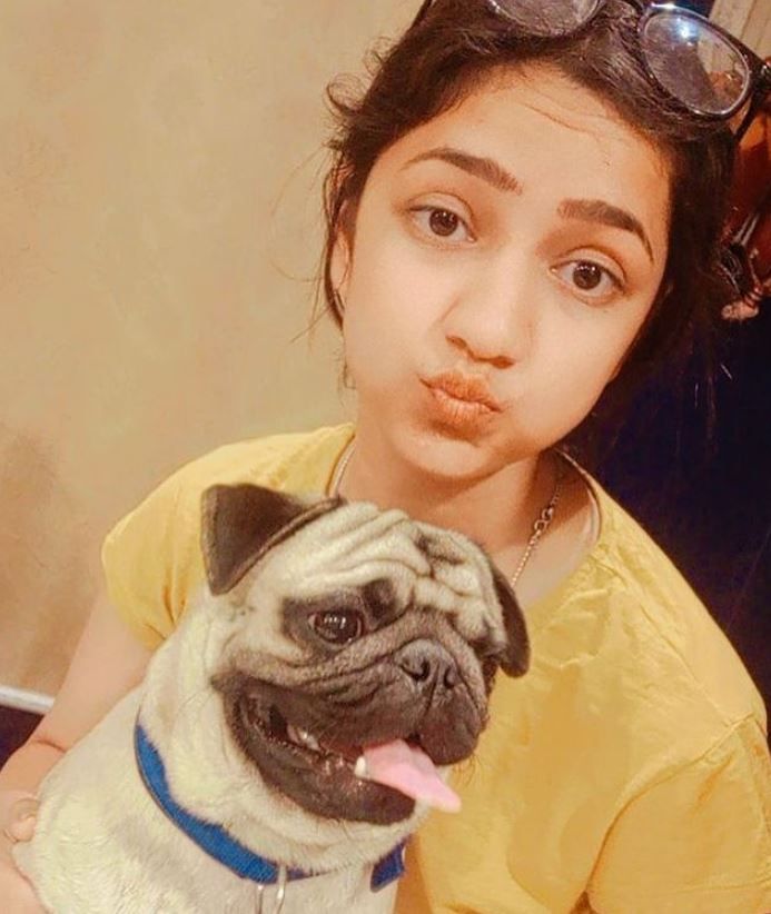 Gungun Upadhyay posing with her pet dog