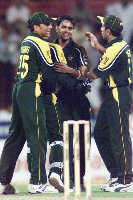Mohammad Hafeez congratulated by Younis Khan and Taufiq Umar after taking a wicket on 3 April 2003