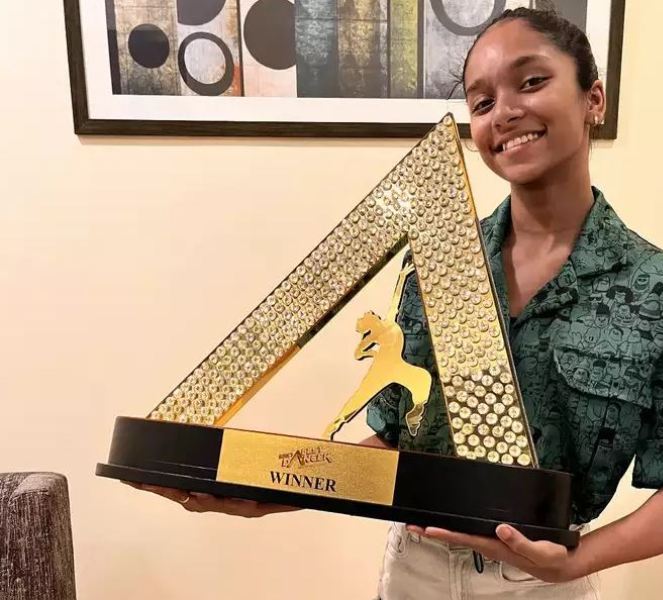 Saumya Kamble posing with the trophy of India's Best Dancer Season 2