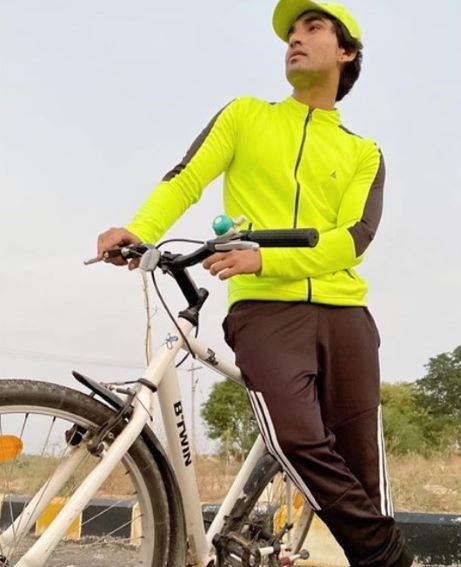 Anil Rathod posing with his cycle