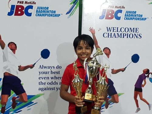 Naishaa Kaur Bhatoye with her Junior Badminton Championship trophies