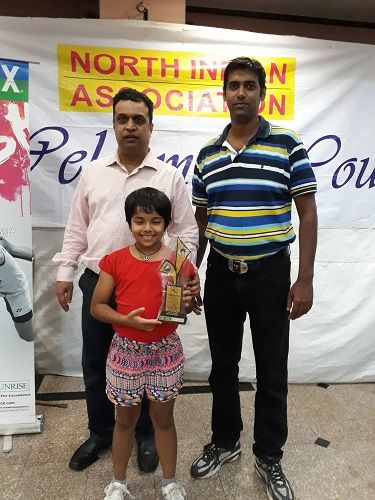 Naishaa Kaur Bhatoye with her father (right) and coach (left)