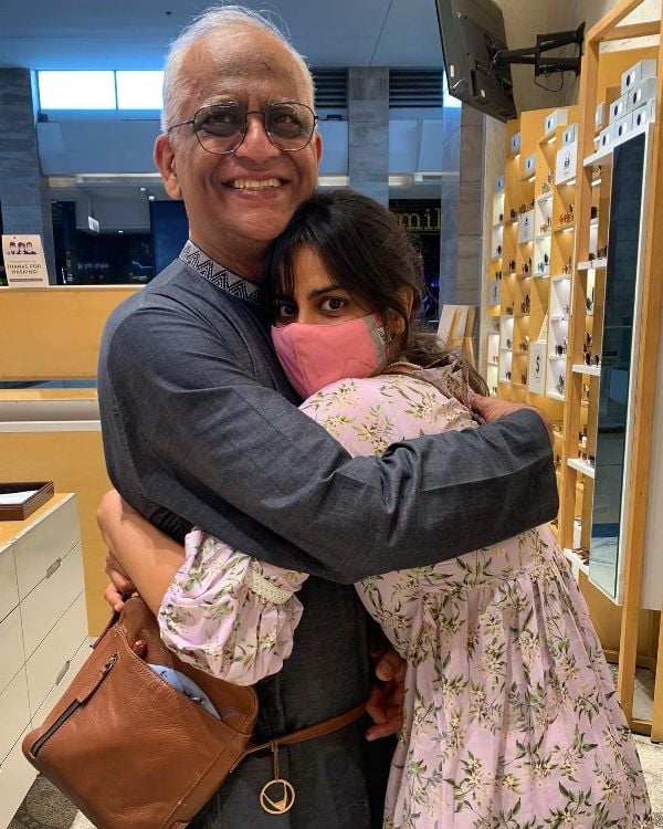 Neha Mahajan hugging her father after concert