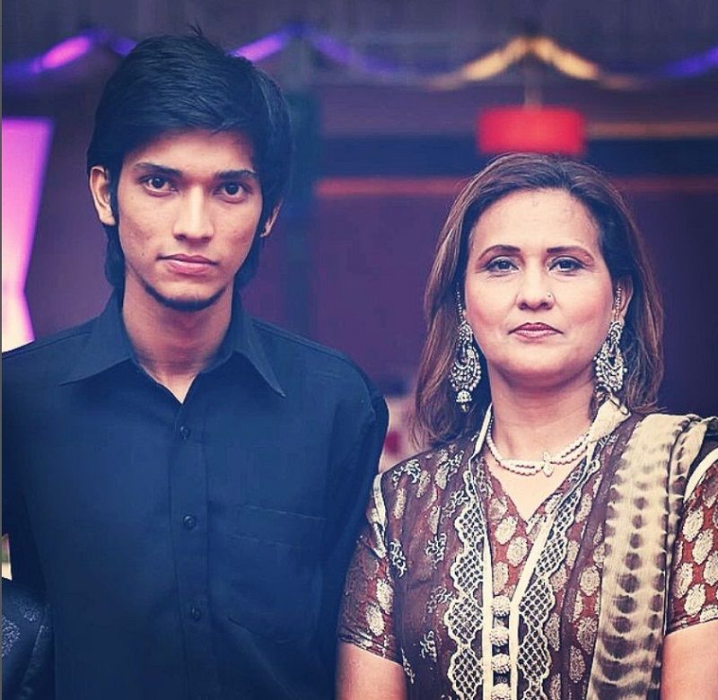 Talhah Anjum with his mother