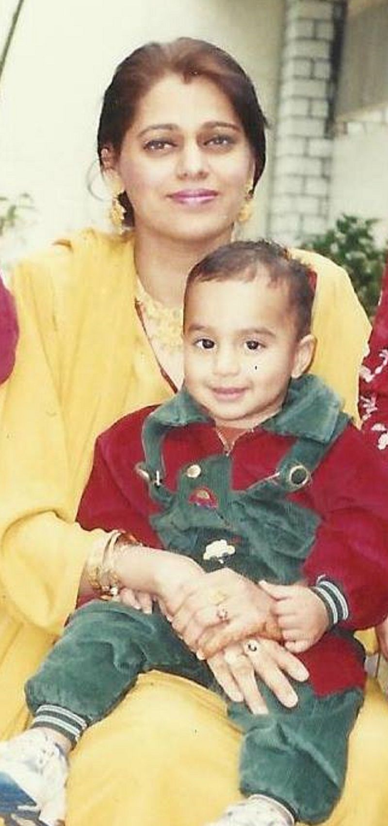 Talhah Yunus as a child with his mother