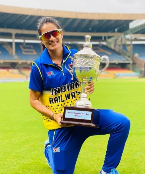 Renuka Singh Thakur poses with the Senior Women's ODI Trophy