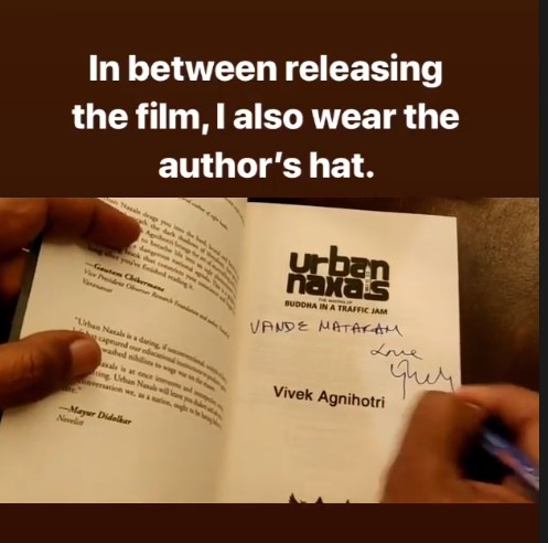 Vivek Agnihotri while signing a book