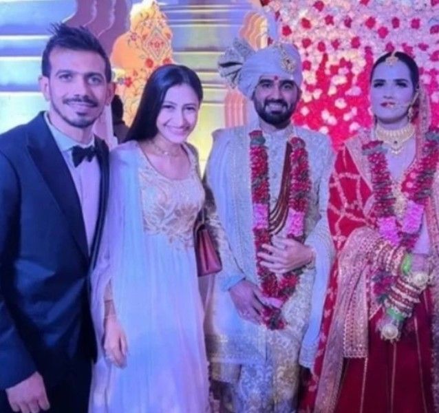 Yuzvendra Chahal and his wife at Riddhi Pannu's wedding