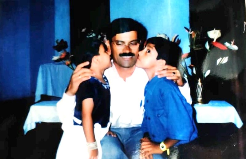 A childhood picture of Tarak Ponnappa with his father and sister