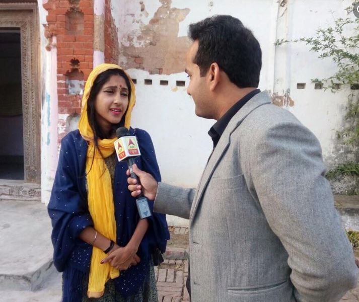 Aman Chopra as a news reporter