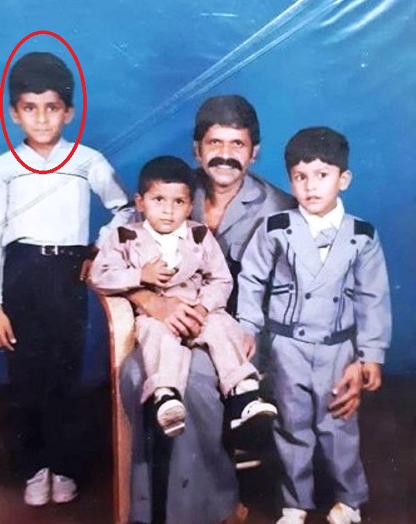 Anish John Kokken (red circled) with his 2 younger brothers and father