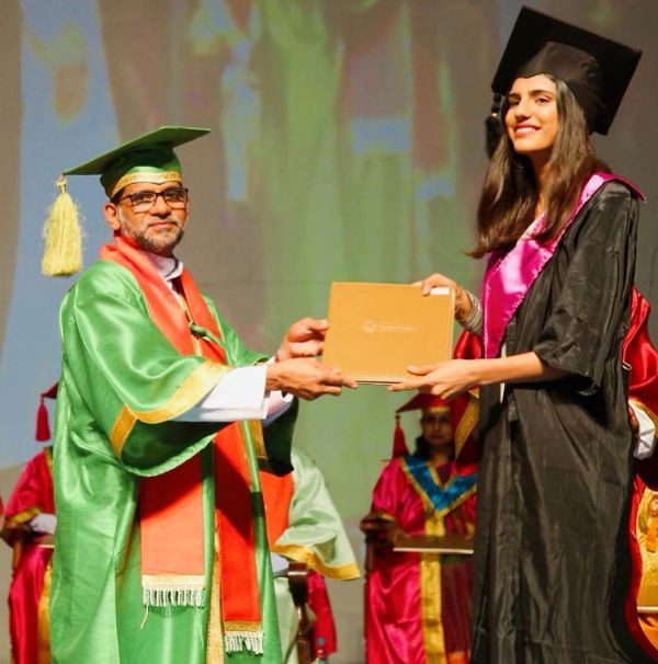 Medha Rana with her bachelor's degree