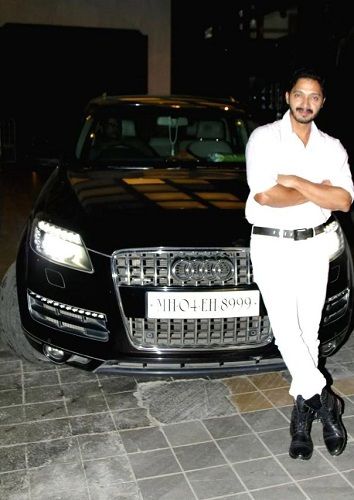 Shreyas Talpade posing with his Audi car