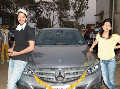 Shreyas Talpade posing with his Mercedes car