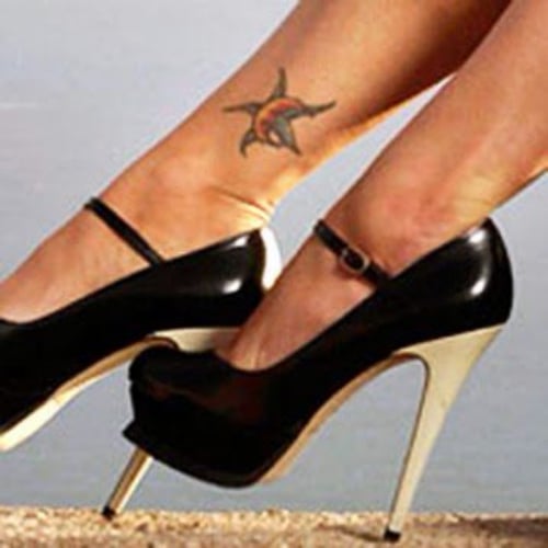 Crescent Moon and Star’ tattoo on her ankle 