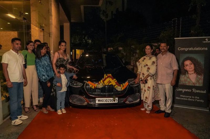 Kangana Ranaut posing with her Marcedes Maybach S Class