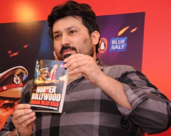 Shadaab Khan with a copy of his novel Murder in Bollywood