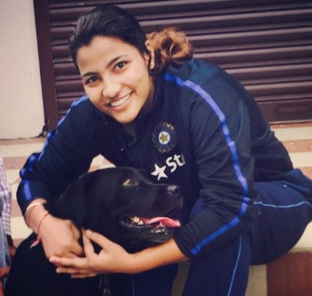 Sneh Rana posing with a dog