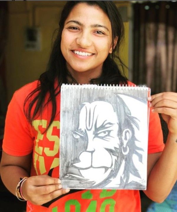 Sneh Rana posing with her sketch