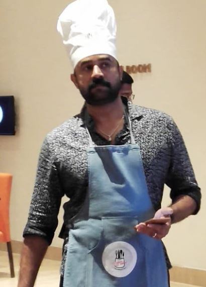Vijay Babu as a chef during a cooking competition