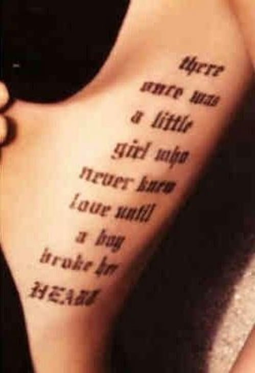 poem tattoo on left side of ribs