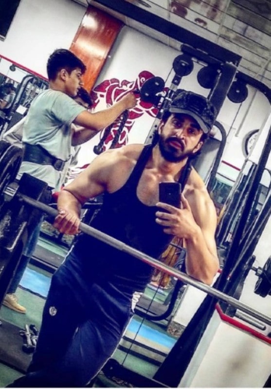 Ajmal Haqiqi exercising in the gym