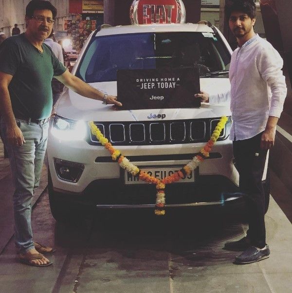 Arjuna Harjai posing with his jeep