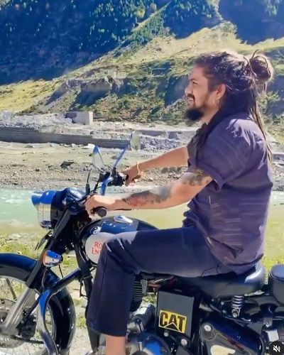 Hansraj Raghuvanshi riding his motorcycle