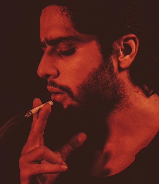 Jibraan Khan while smoking a cigarette