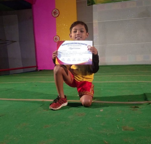 Nobojit Narzary with his dance competition certificate