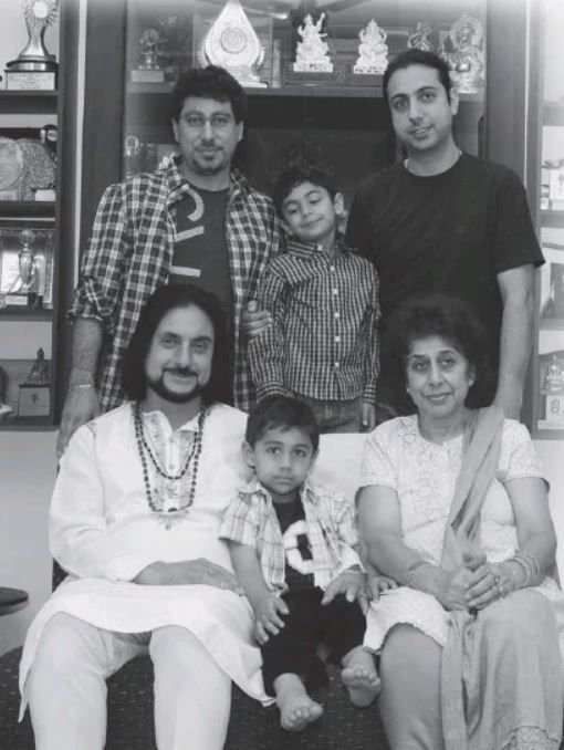 Pandit Bhajan Sopori with his wife, sons, and grandsons