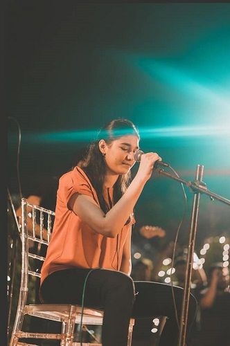 Shae Gill performing on stage