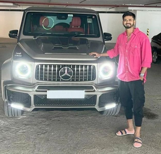 Shreyas Iyer posing in front of his new Mercedes-Benz G63 AMG SUV