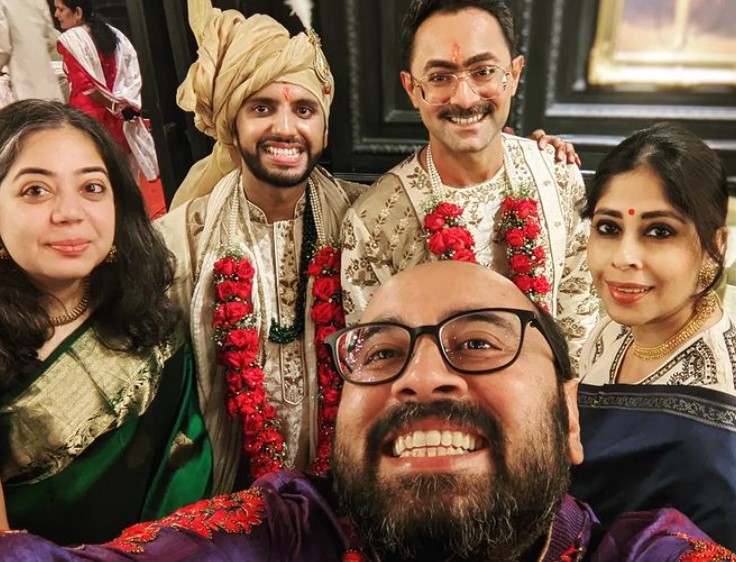 Abhishek Ray (right) with his gay partner and family members