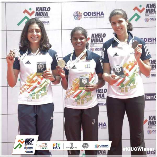 Aishwarya B (centre) flaunting her gold medal at Khelo India University Games 2020