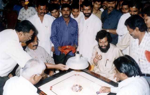 Dighe playing the carrom board game with his friends
