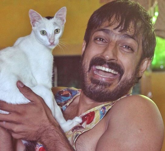 Harish Uthaman with his pet cat