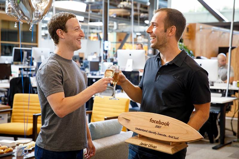 Javier Olivan and Mark Zuckerberg drinking champagne