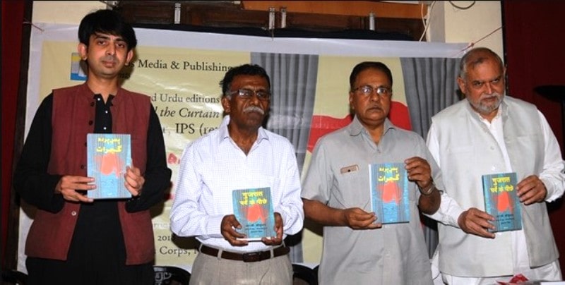 R. B. Sreekumar holding the Urdu edition of his book Gujarat: Behind the Curtain during its launch event