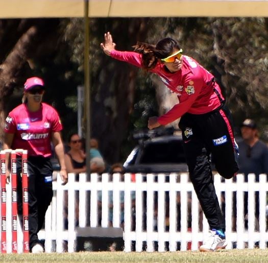 Radha Yadav playing for Sydney Sixers against Melbourne Renegades in a WBBL match at Lilac Hill Park, Perth