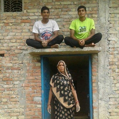 Rohit Yadav with his mother and brother