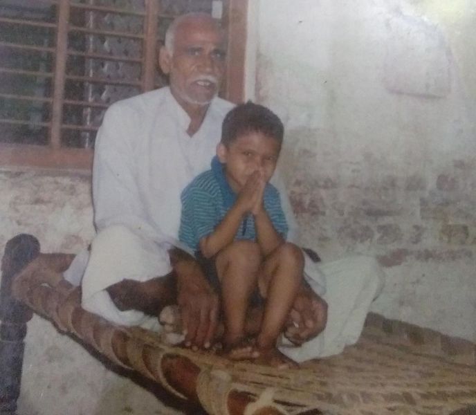 A childhood photo of Sagar Narwat with his grandfather 