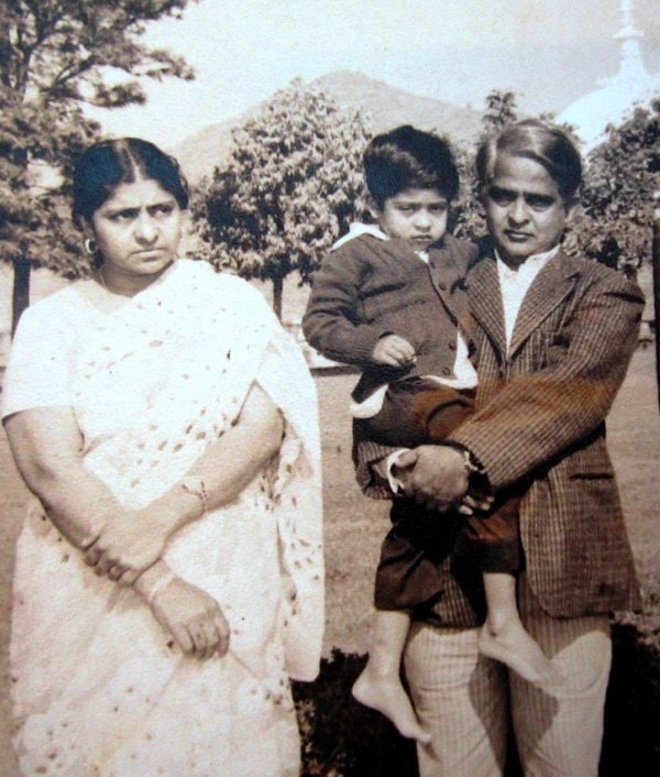 A childhood photograph of Zubair with his parents