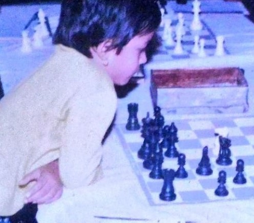 Childhood picture of Bhakti Kulkarni playing chess